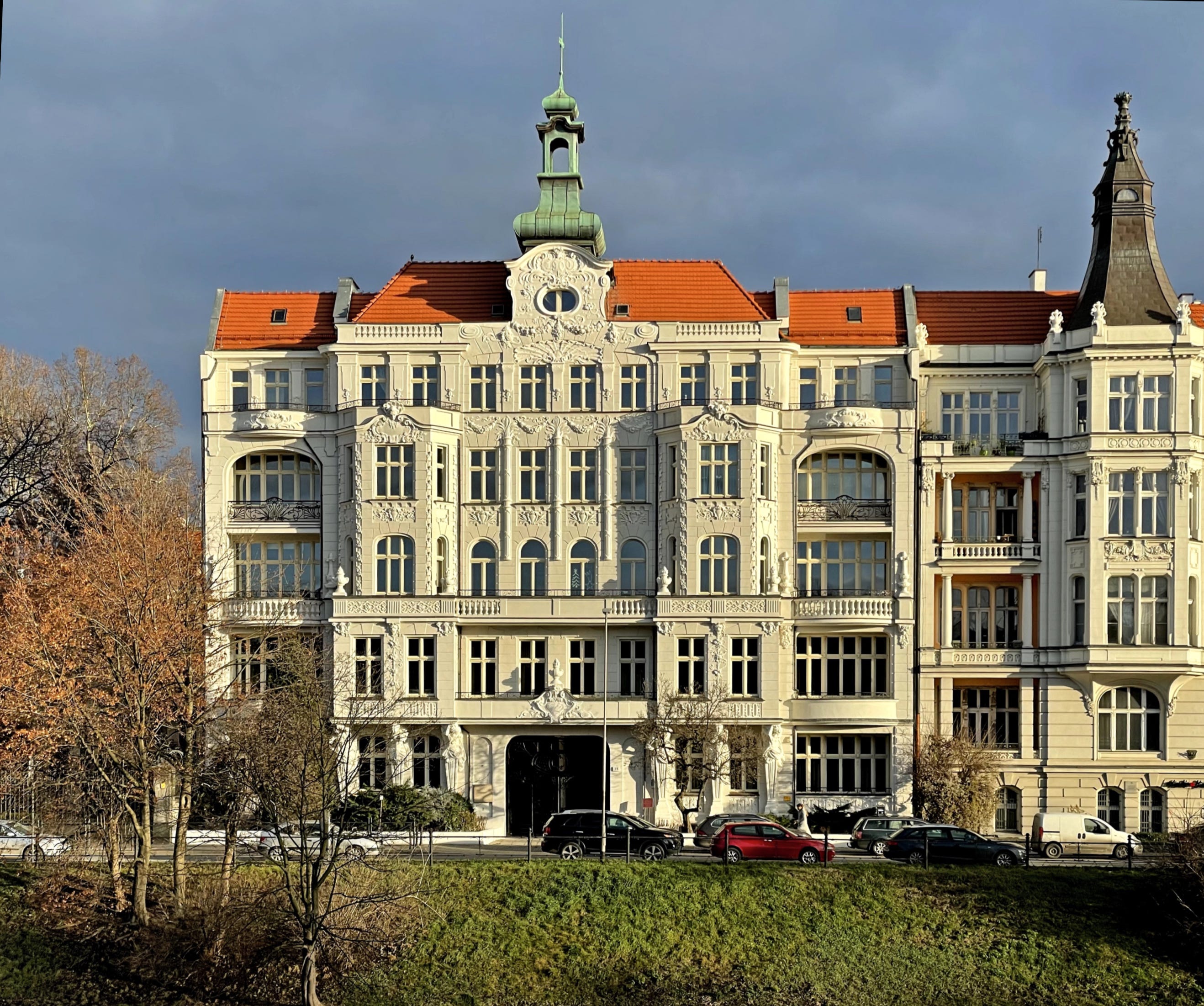 Detailed view of hands holding a gua sha for skincare rituals in a cozy bathroom setting.